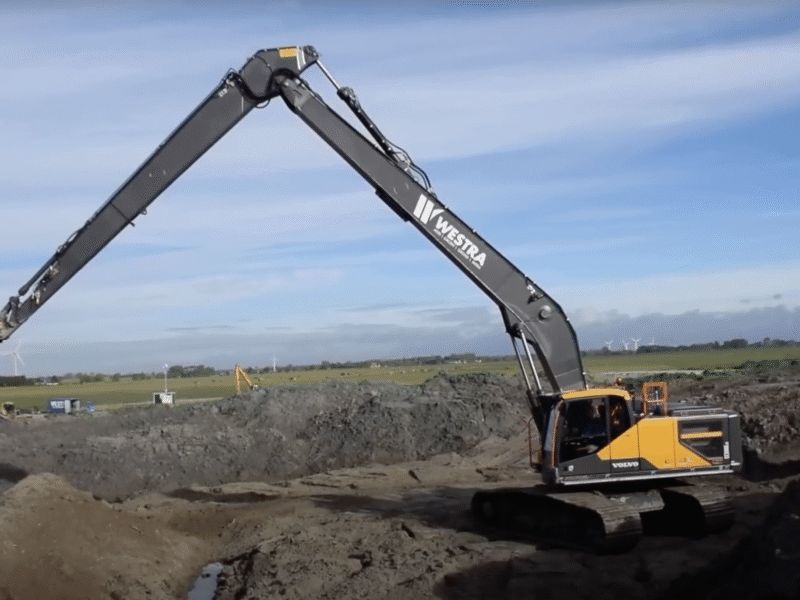 Image of a volvo long reach excavator working a site