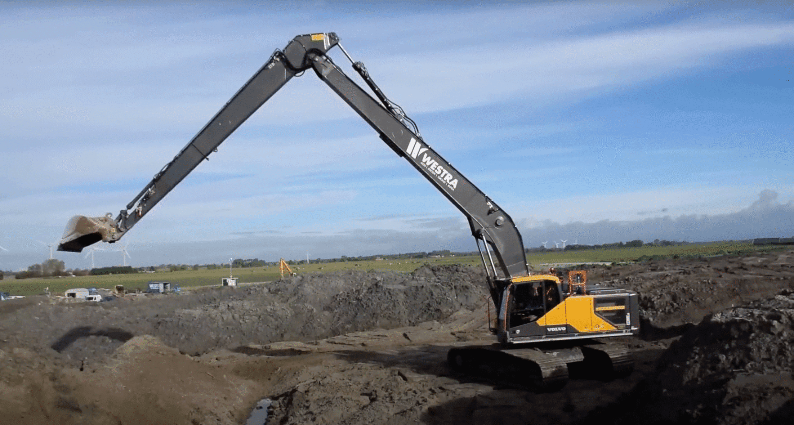 Image of a volvo long reach excavator working a site